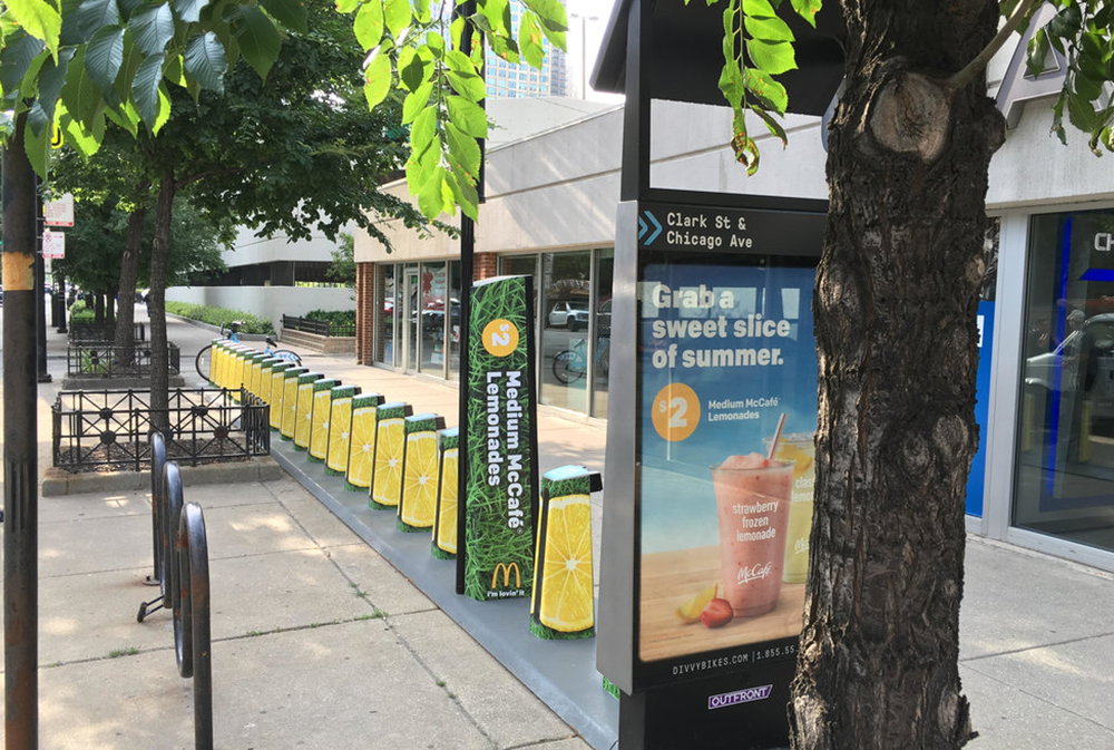 Branded bike share kiosk with high pedestrian dwell time