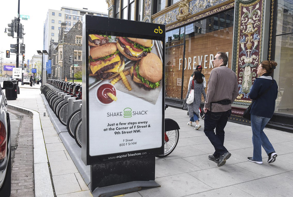 Rolling bike media carrying the message through retail corridors